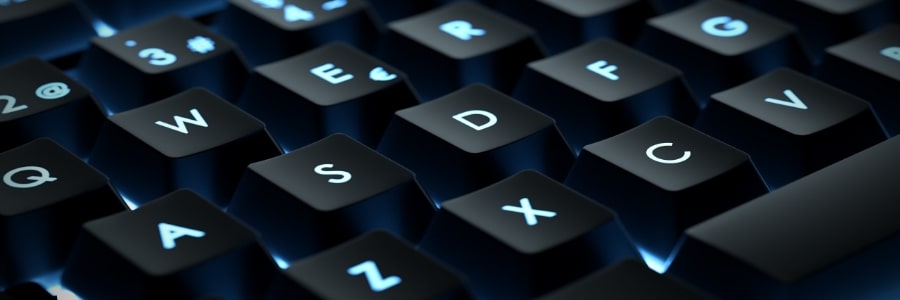 A closeup photo of a computer keyboard with blue lighting