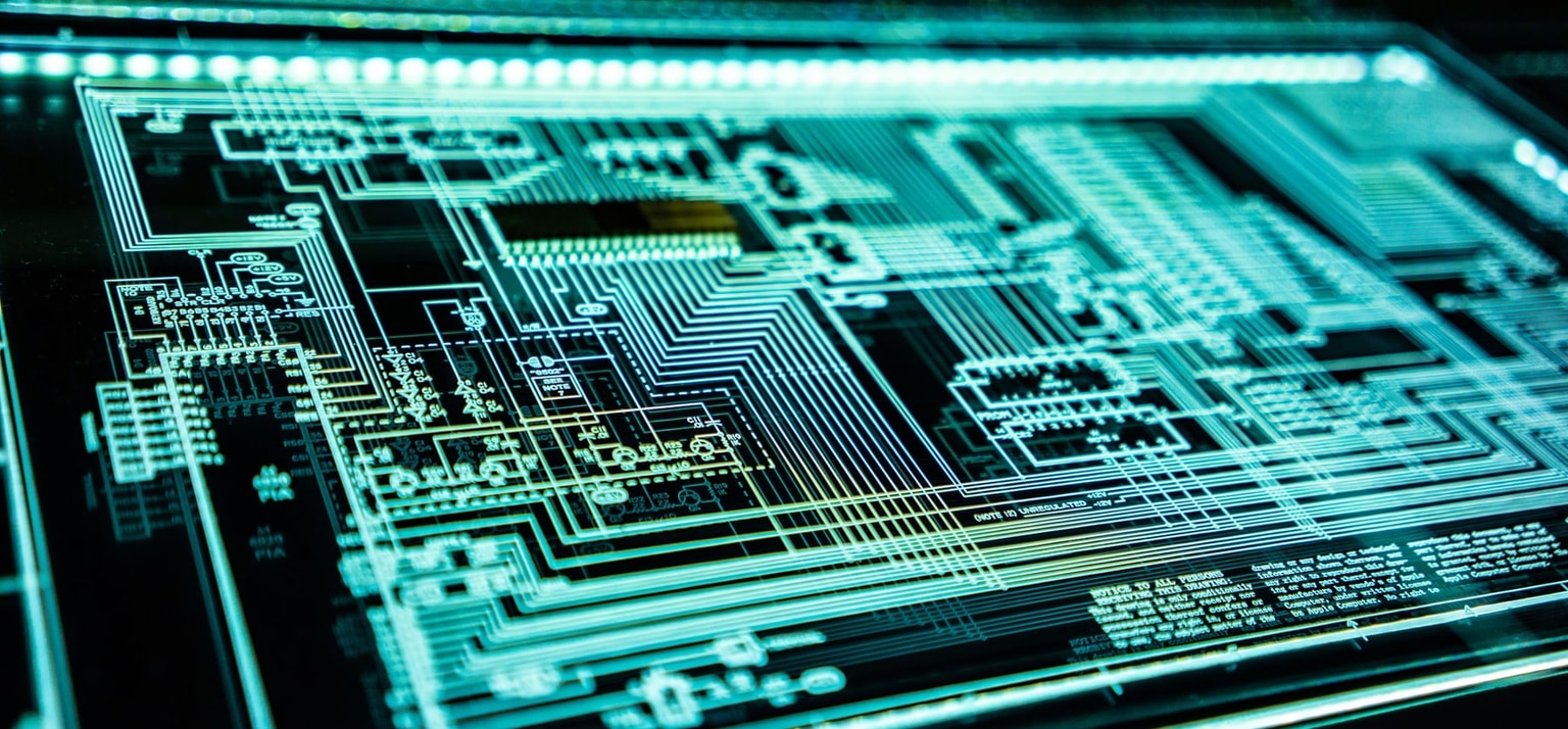 Glowing digital circuit board representing memory, computing infrastructure and AI hardware.